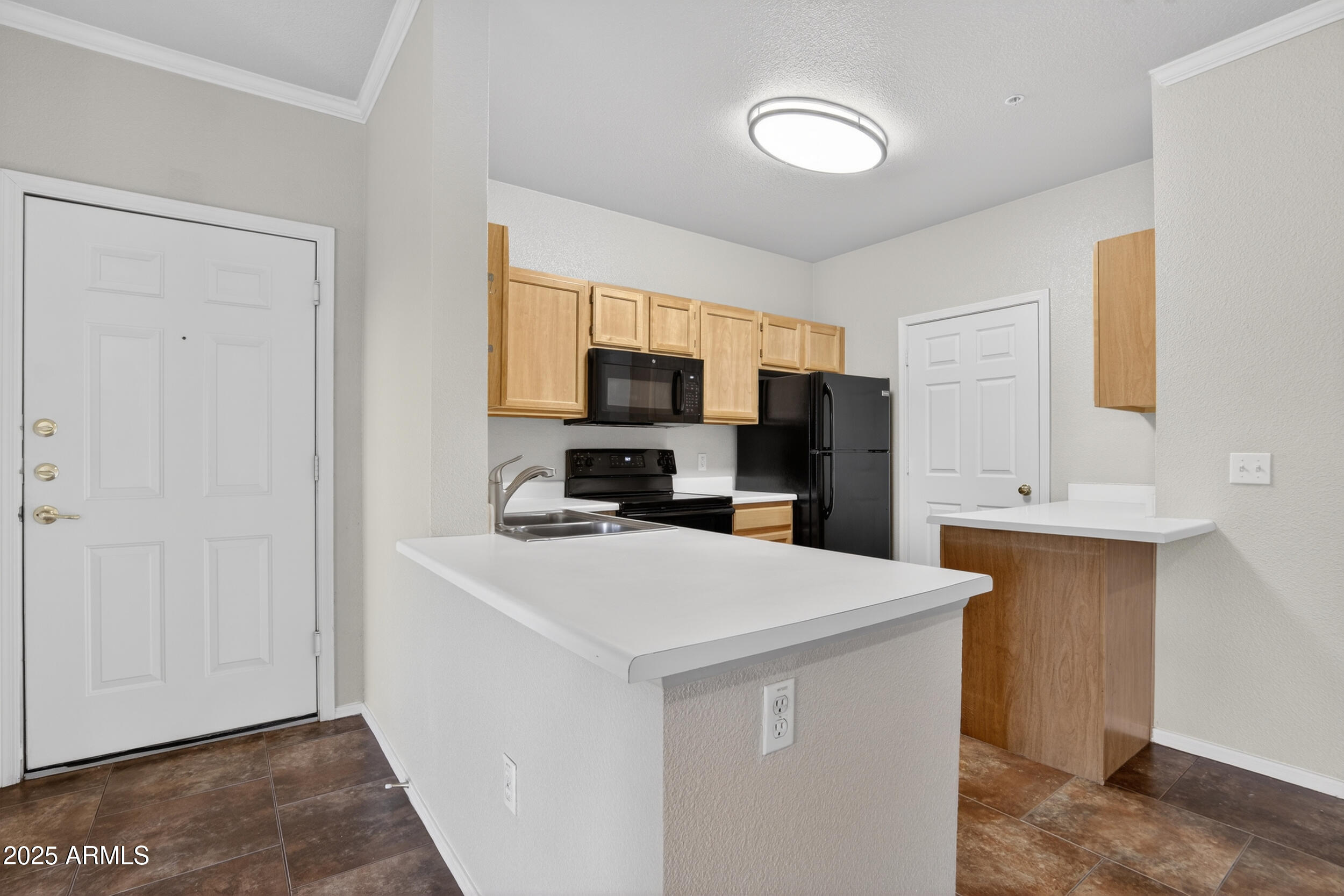 5401 East Van Buren Street, Unit 2076 Phoenix, AZ 85008 - Photo 6 of 41 a kitchen with stainless steel appliances a refrigerator stove microwave and sink