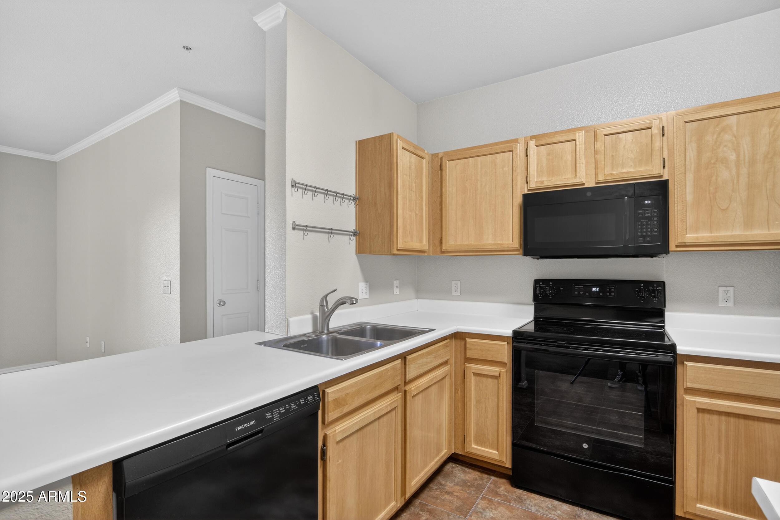 5401 East Van Buren Street, Unit 2076 Phoenix, AZ 85008 - Photo 8 of 41 a kitchen with a sink stove and microwave