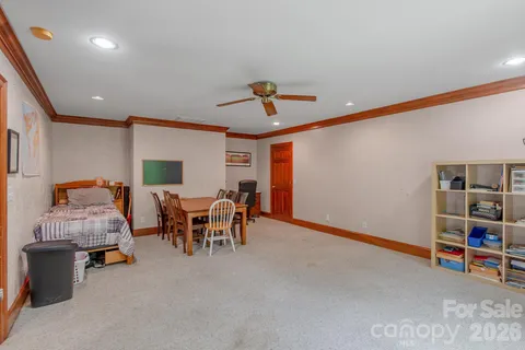 a view of a livingroom with furniture and a ceiling fan