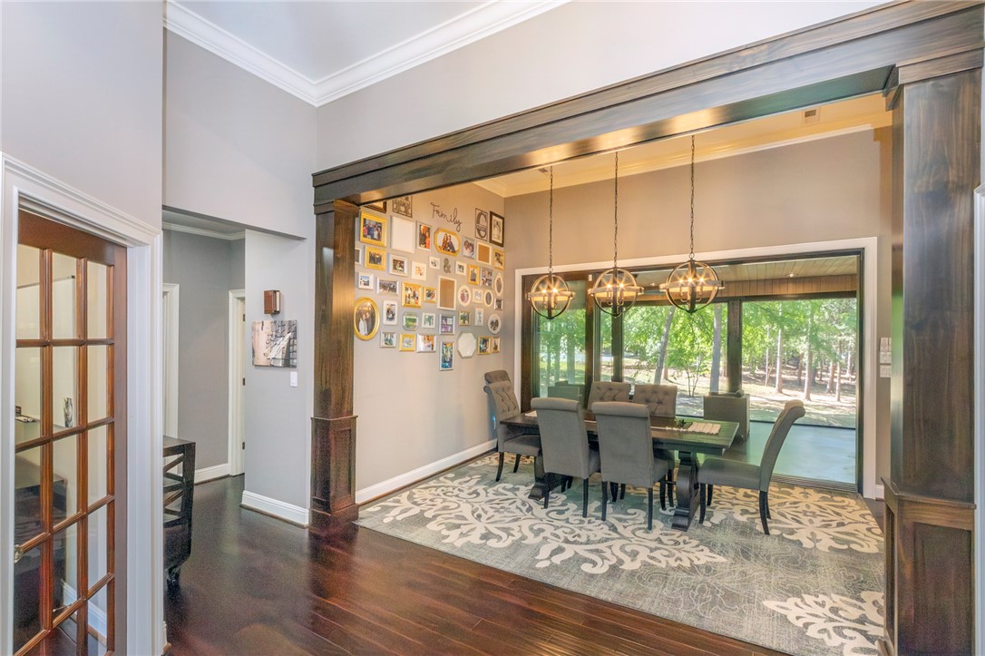 4420 Denver Cove Road Anderson, SC 29625 - Photo 13 of 50 This spacious dining area features sleek flooring, crown molding, and an abundance of natural light.