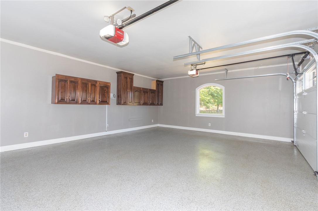 4420 Denver Cove Road Anderson, SC 29625 - Photo 17 of 50 This spacious garage offers excellent storage solutions and a pristine, easy-to-maintain floor.