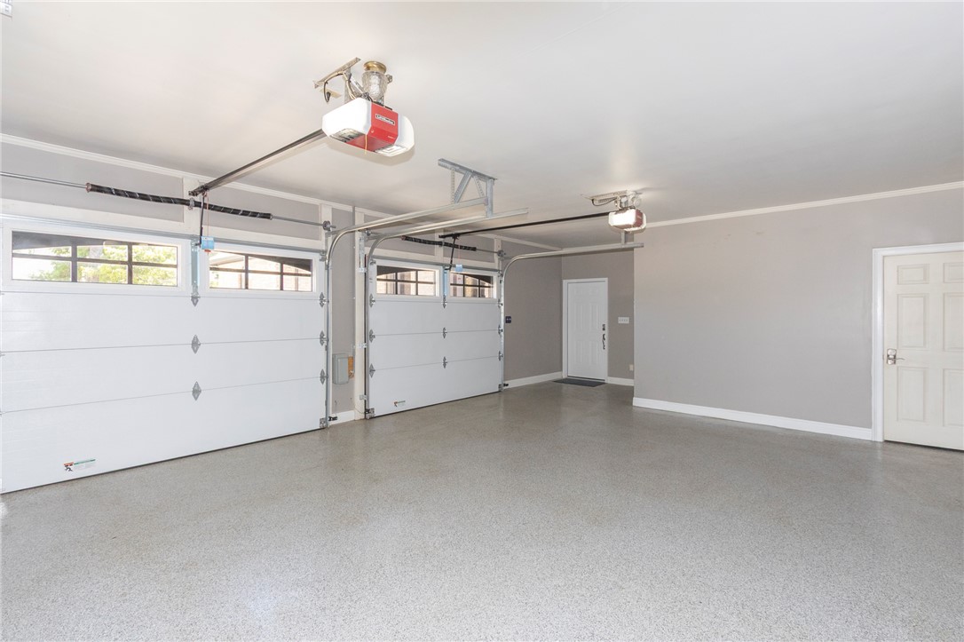 4420 Denver Cove Road Anderson, SC 29625 - Photo 18 of 50 This spacious garage offers ample parking with a durable, easy-to-maintain floor finish.