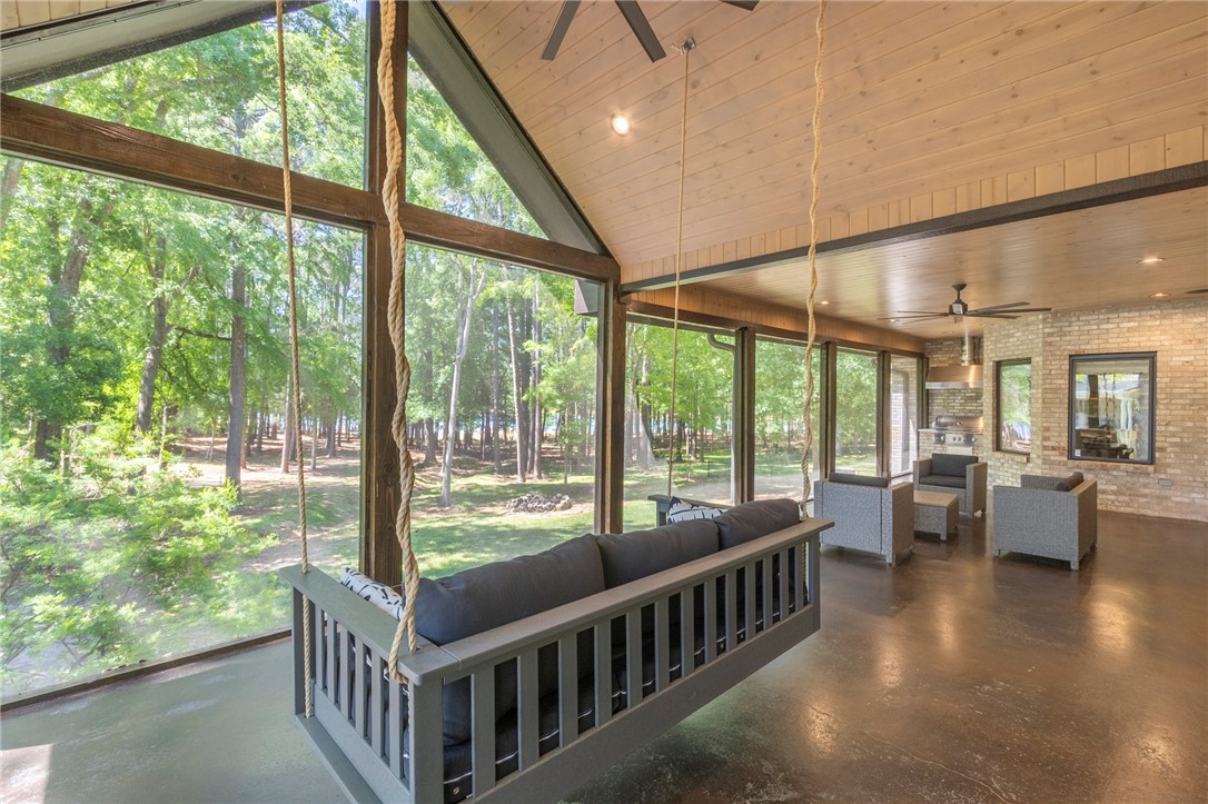 4420 Denver Cove Road Anderson, SC 29625 - Photo 19 of 50 This screened porch provides a perfect blend of comfort and nature with an outdoor kitchen.