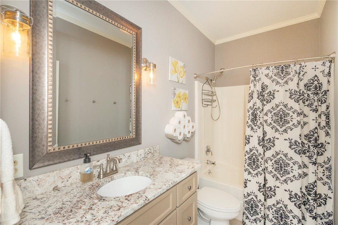 4420 Denver Cove Road Anderson, SC 29625 - Photo 25 of 50 This bathroom features a sleek vanity, elegant mirror, and a classic shower, offering both comfort and style.