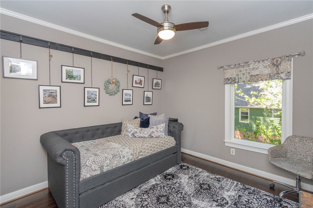 4420 Denver Cove Road Anderson, SC 29625 - Photo 26 of 50 This cozy bedroom features elegant crown molding and rich hardwood flooring.