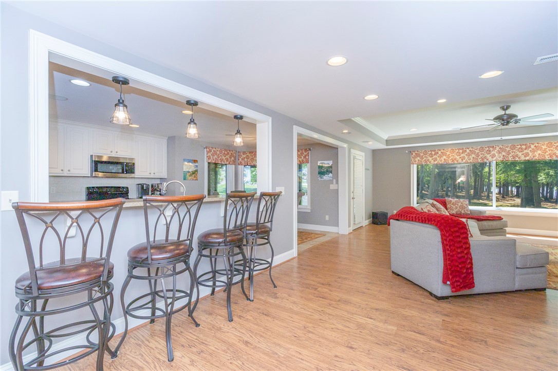 4420 Denver Cove Road Anderson, SC 29625 - Photo 32 of 50 This inviting space seamlessly connects the kitchen and living areas, offering a comfortable and bright atmosphere.