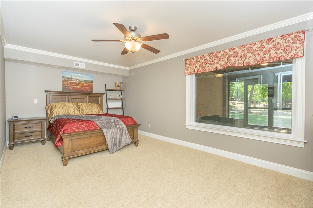 4420 Denver Cove Road Anderson, SC 29625 - Photo 37 of 50 This spacious bedroom offers ample natural light and comfortable carpeting.