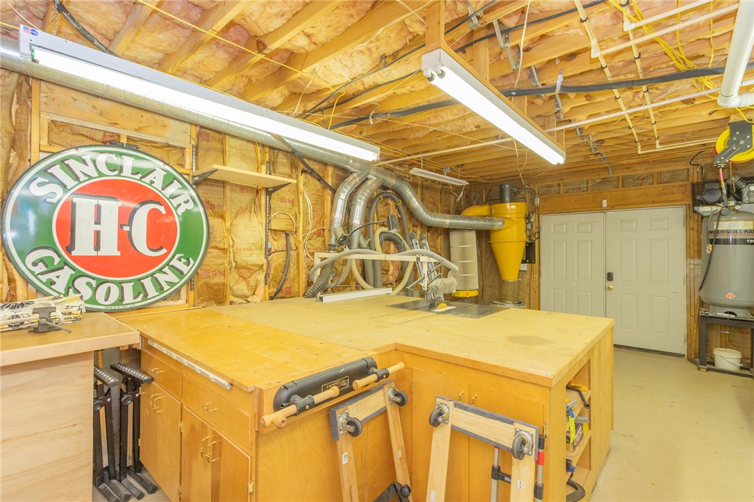 4420 Denver Cove Road Anderson, SC 29625 - Photo 40 of 50 This dedicated workshop offers ample space for projects with organized work areas.