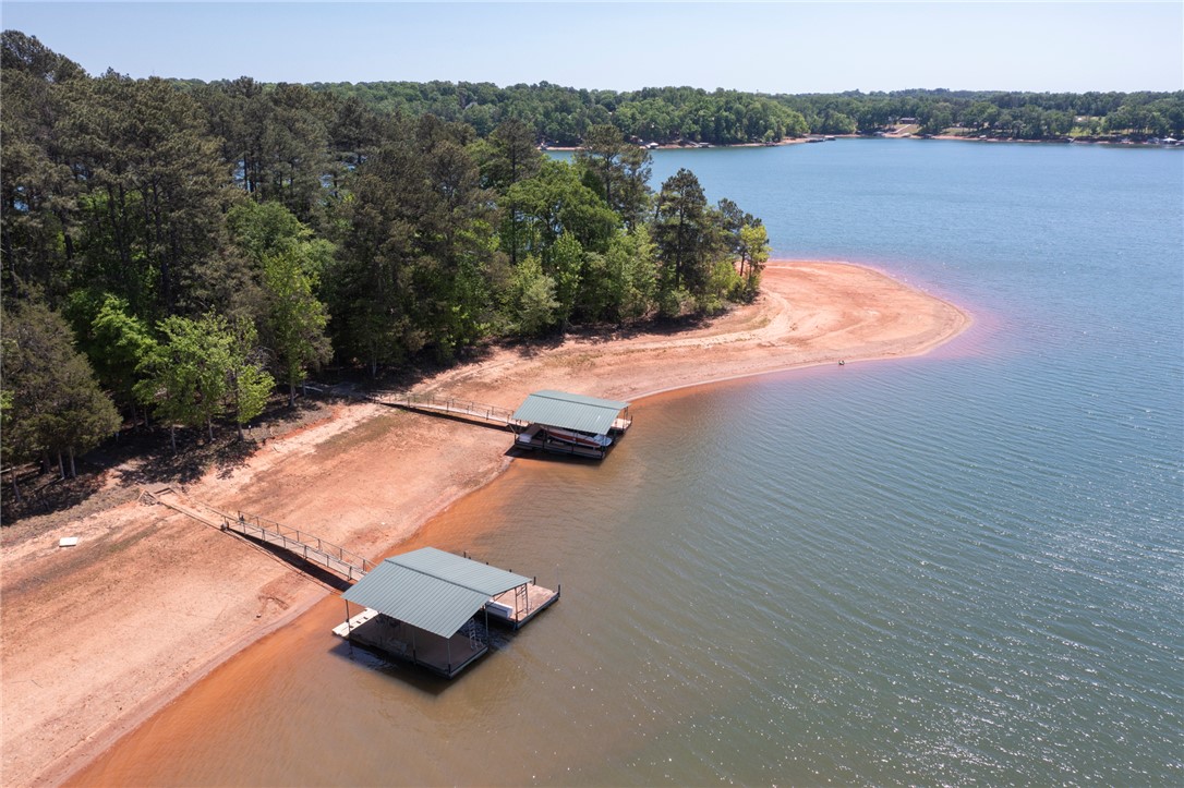 4420 Denver Cove Road Anderson, SC 29625 - Photo 48 of 50 This serene lakefront property features private boat docks, offering direct access to tranquil waters and lush natural surroundings.