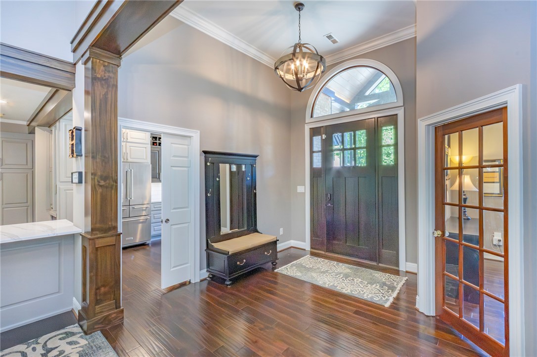 4420 Denver Cove Road Anderson, SC 29625 - Photo 5 of 50 Enter this home featuring rich wood flooring, high ceilings, and an arched transom window.