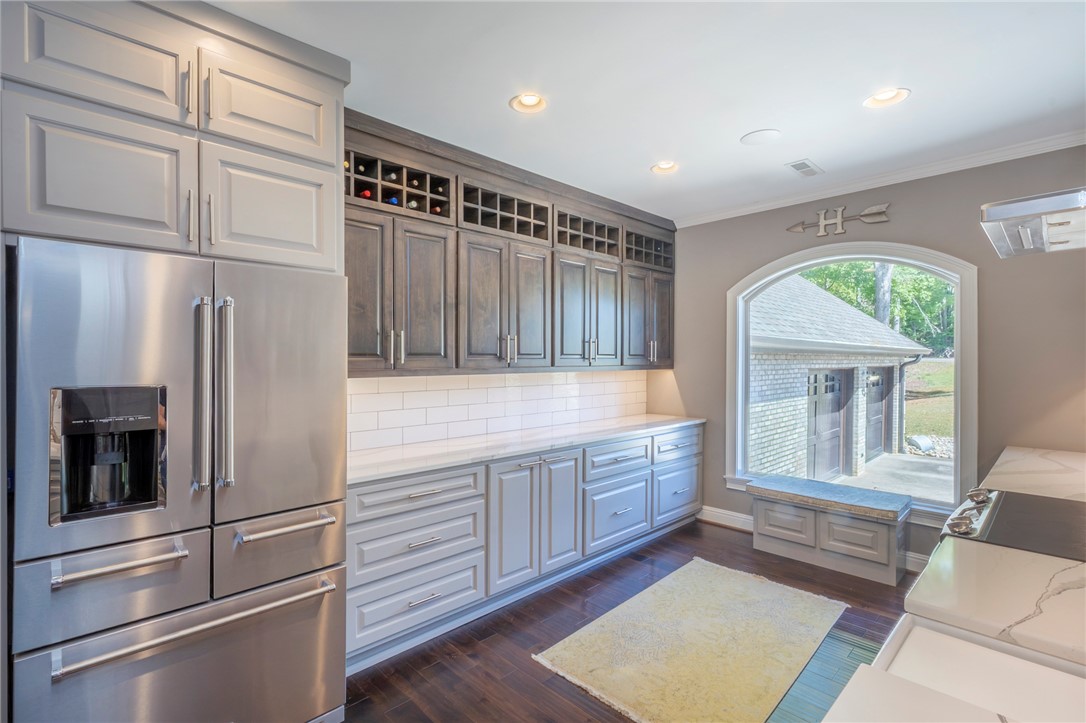 4420 Denver Cove Road Anderson, SC 29625 - Photo 9 of 50 This spacious kitchen offers ample storage and modern amenities, perfect for culinary endeavors and entertaining guests.