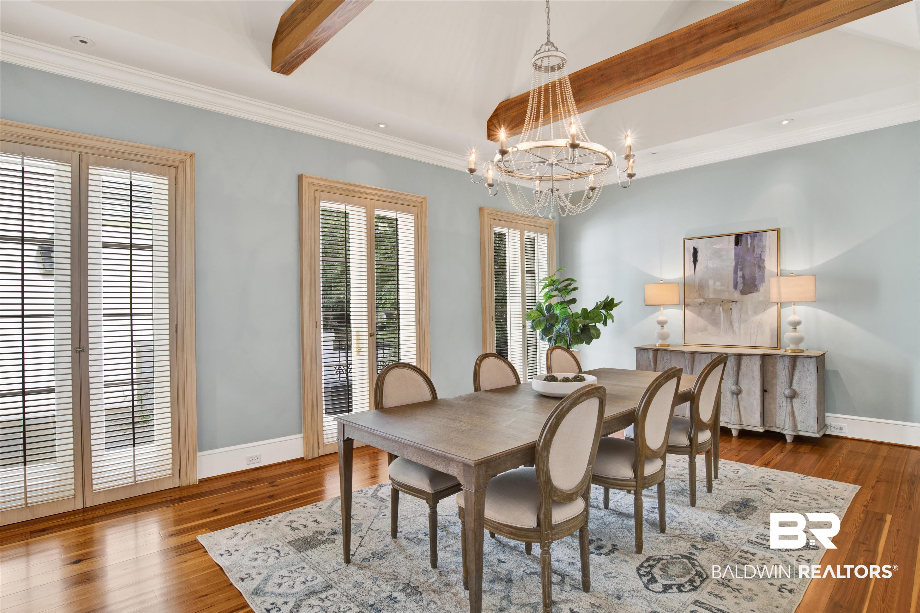 3816 Austill Lane Mobile, AL 36608 - Photo 21 of 80 Dining area with beam ceiling, wood finished floors, ornamental molding, and a chandelier