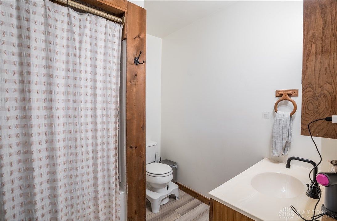 220 Racer Street Troy, OH 45373 - Photo 18 of 33 This bathroom features durable flooring and functional fixtures, offering a comfortable and efficient space.