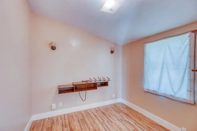 a room with furniture and wooden floor