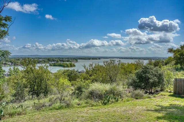a view of a lake from a yard