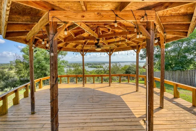 a view of a balcony with wooden floor