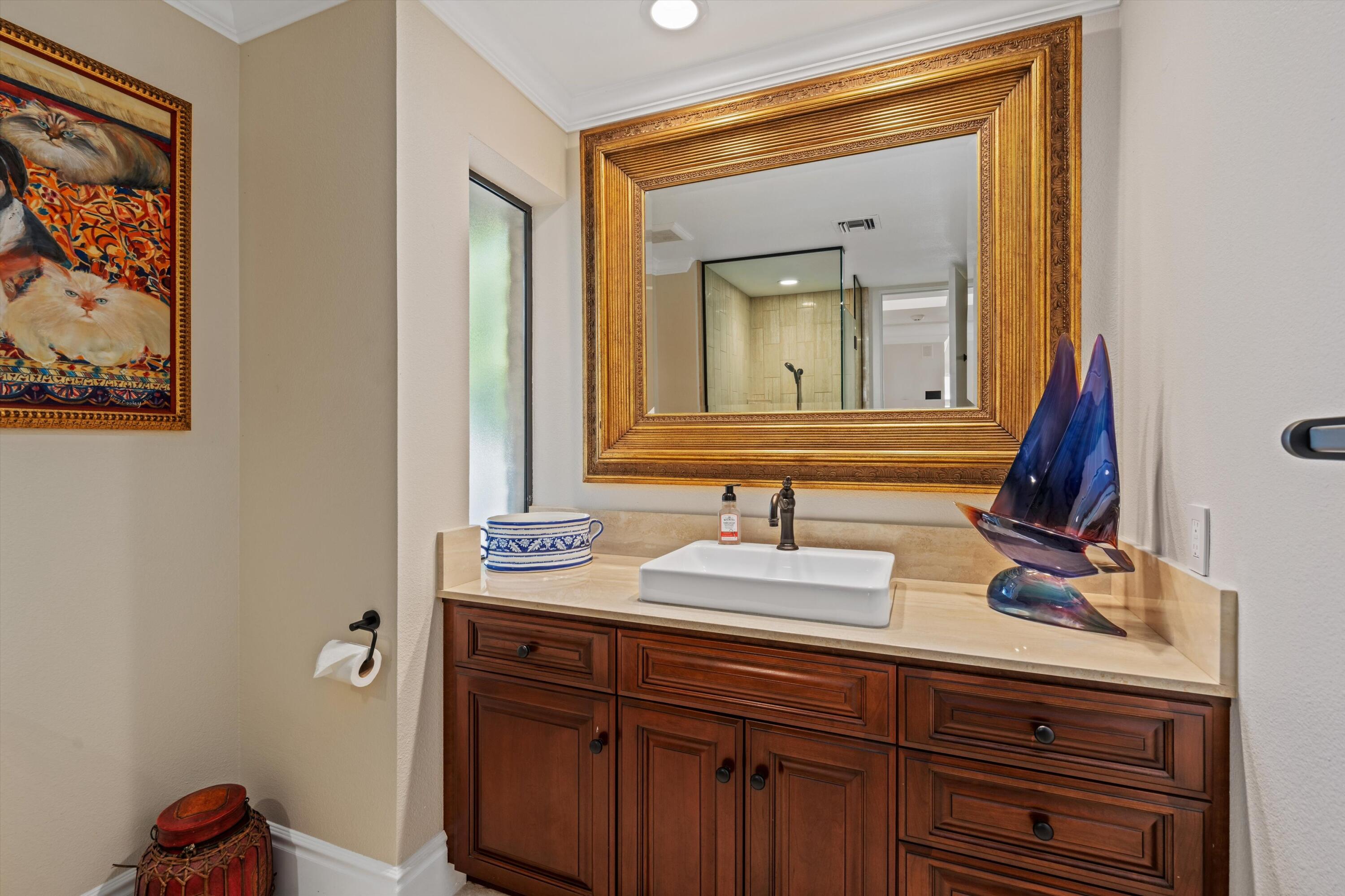 1 Mayfair Drive Rancho Mirage, CA 92270 - Photo 39 of 40 a bathroom with a sink and a mirror