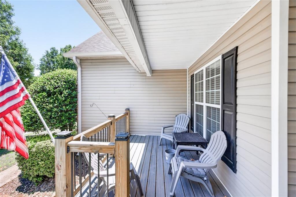 89 Katie Spring Lane Jefferson, GA 30549 - Photo 58 of 63 a view of balcony with wooden floor and outdoor seating