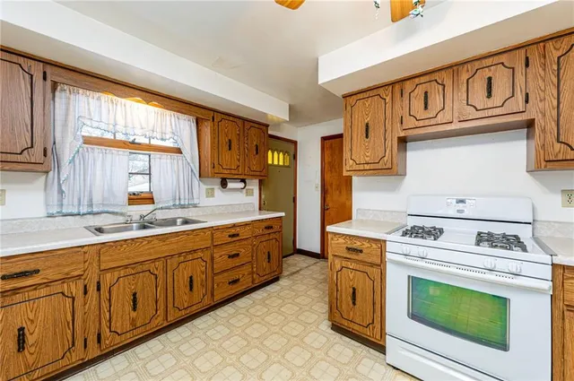 an empty room with yard & large window