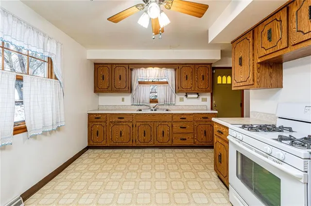 a view of an empty room with closet and wooden floor