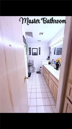 a view of a living room and kitchen