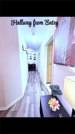 a view of kitchen with furniture and wooden floor