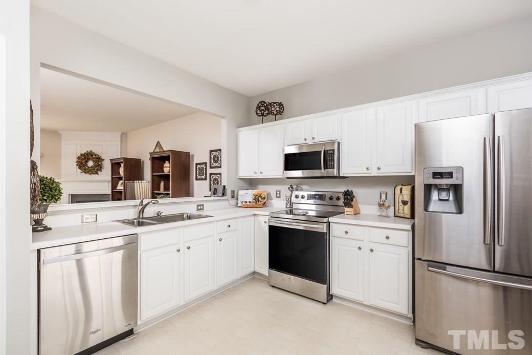 5443 Golden Arrow Lane Raleigh, NC 27613 - Photo 2 of 9 Bright kitchen with a large dining area and pantry. Stainless Steel appliances and plenty of counter and cabinet space.