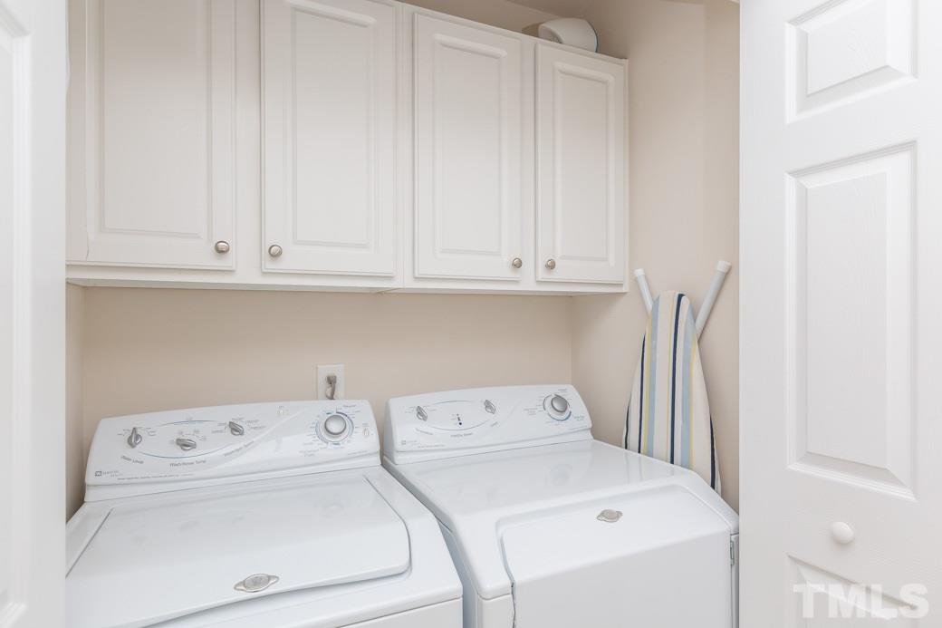 5443 Golden Arrow Lane Raleigh, NC 27613 - Photo 6 of 9 The laundry area is upstairs with the bedrooms for convenience.