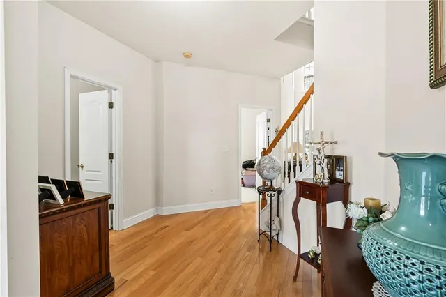 a view of entryway with wooden floor