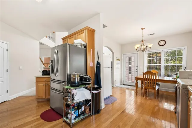 a bedroom with furniture and a large window