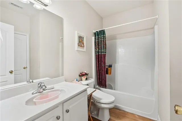 a bed room with a bed and a chair