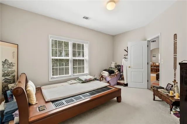 a view of a hallway with a livingroom and entryway