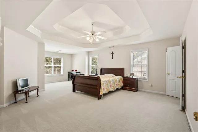 a room with a chair and cabinets