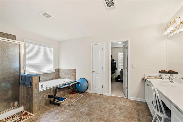a white toilet sitting next to a bathroom sink
