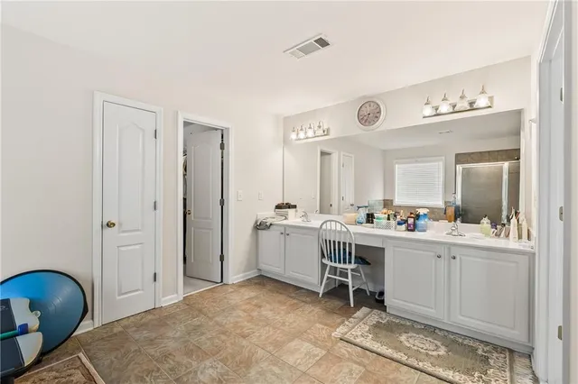 a bed room with a bed and a window