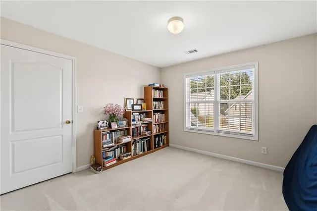 a view of a patio with table and chairs and potted plants