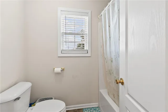 a backyard of a house with a tree