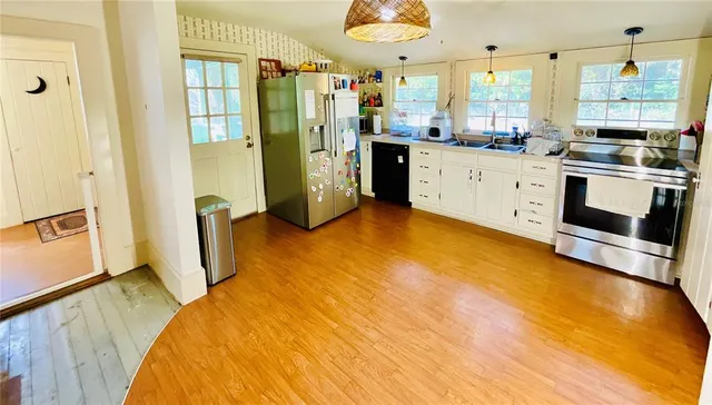 a view of living room with furniture and a window