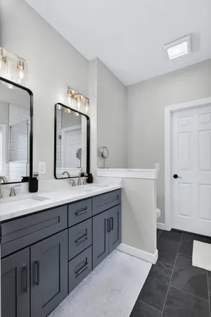 a view of a roof deck with table and chairs a barbeque with wooden floor and fence