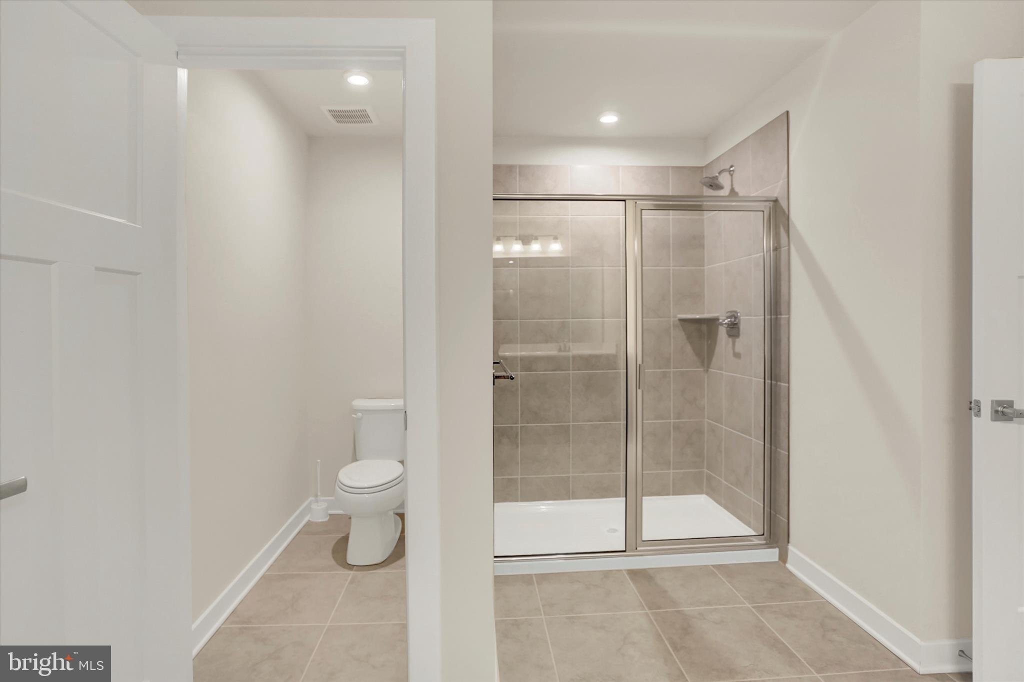 4003 Allyson Road Harrisburg, PA 17110 - Photo 26 of 45 Primary bath with tiled shower & separate toilet