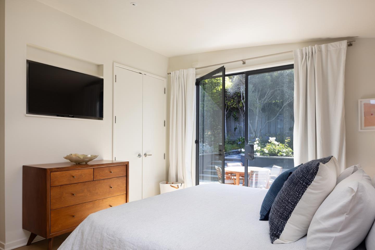 0 Scenic & 10th Corner Carmel, CA 93923 - Photo 12 of 23 a bedroom with a bed and a window