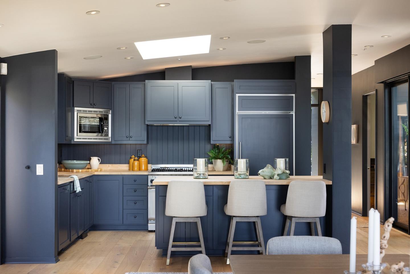 0 Scenic & 10th Corner Carmel, CA 93923 - Photo 8 of 23 a room with stainless steel appliances a table chairs refrigerator and sink