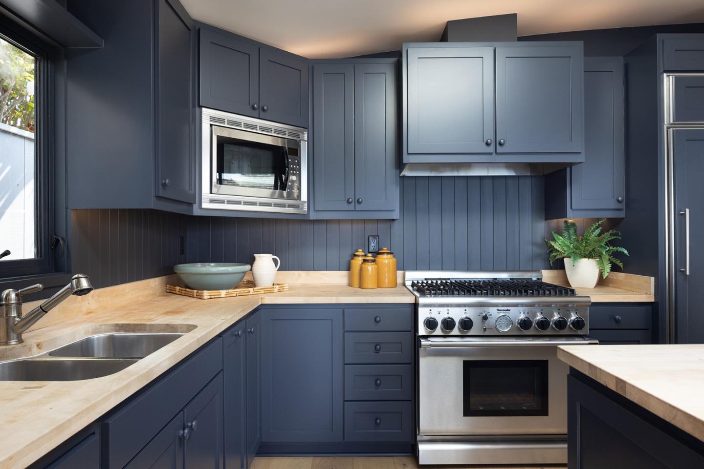 0 Scenic & 10th Corner Carmel, CA 93923 - Photo 10 of 23 a kitchen with granite countertop cabinets stainless steel appliances and wooden floor