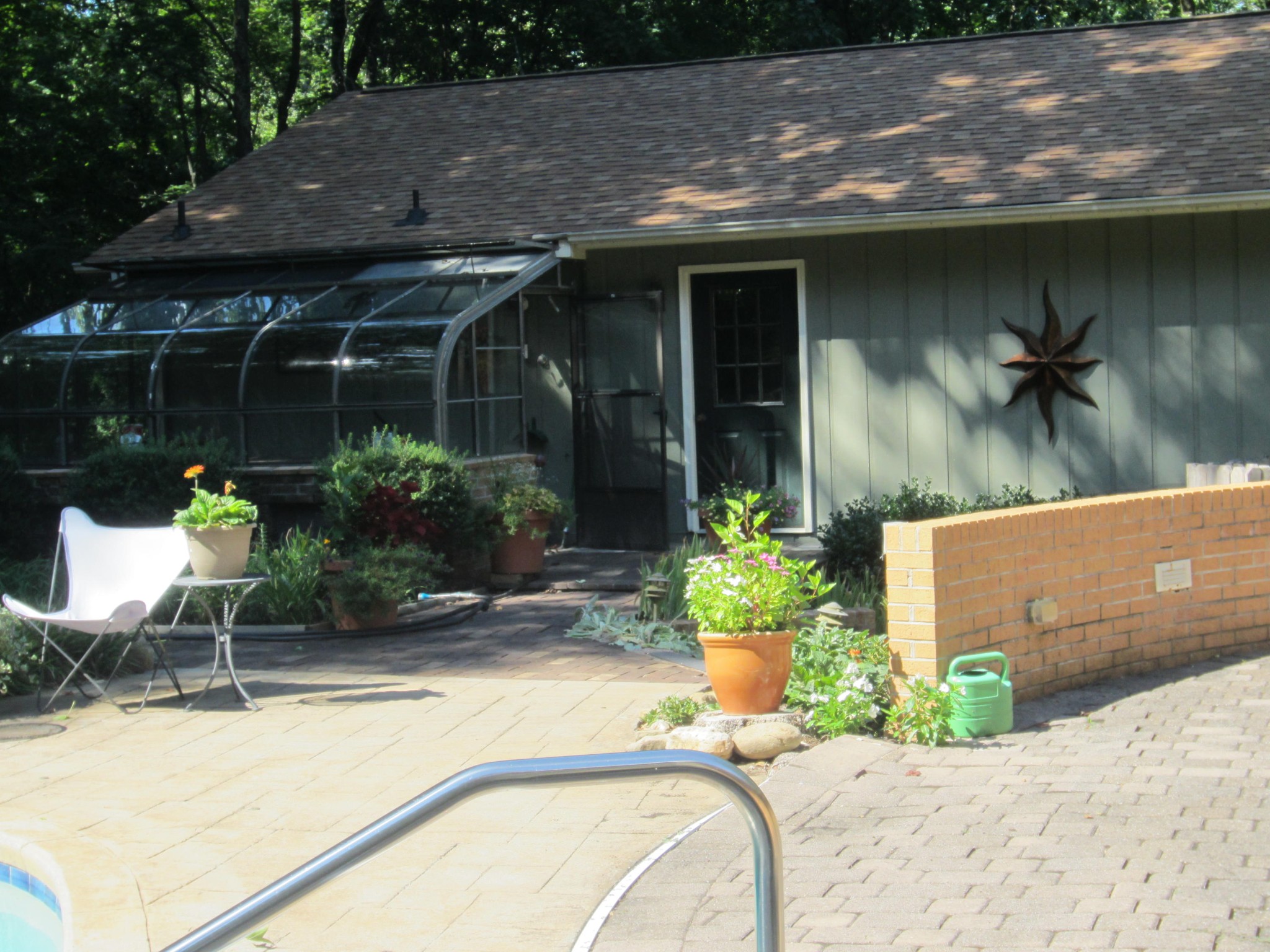 105 Burgess Lane Oak Ridge, TN 37830 - Photo 8 of 26 a backyard of a house with table and chairs under an umbrella