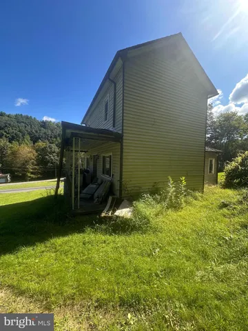 a view of backyard with seating space