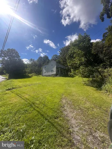 a view of an ocean and a yard