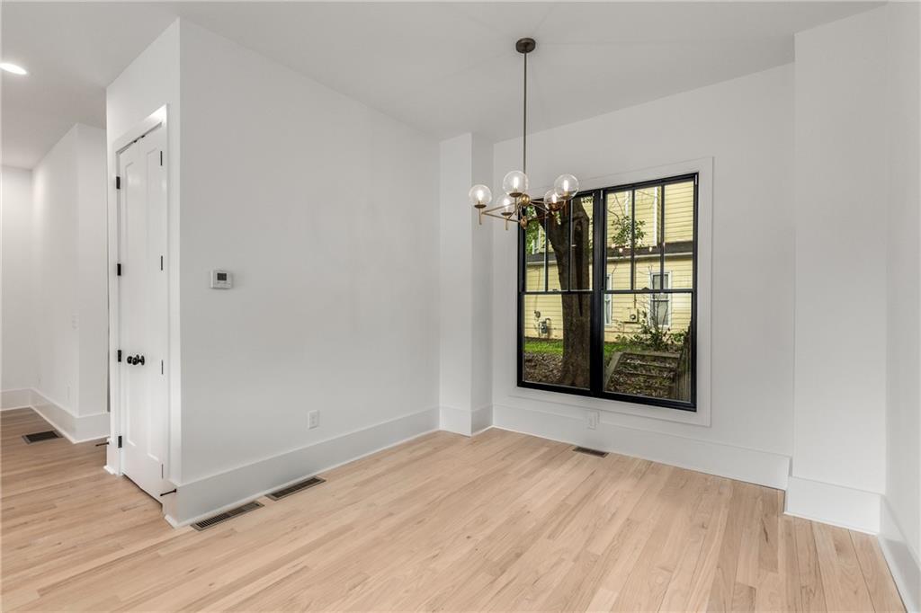 628 Robinson Avenue Southeast, Unit B Atlanta, GA 30312 - Photo 20 of 77 a view of an empty room window and wooden floor