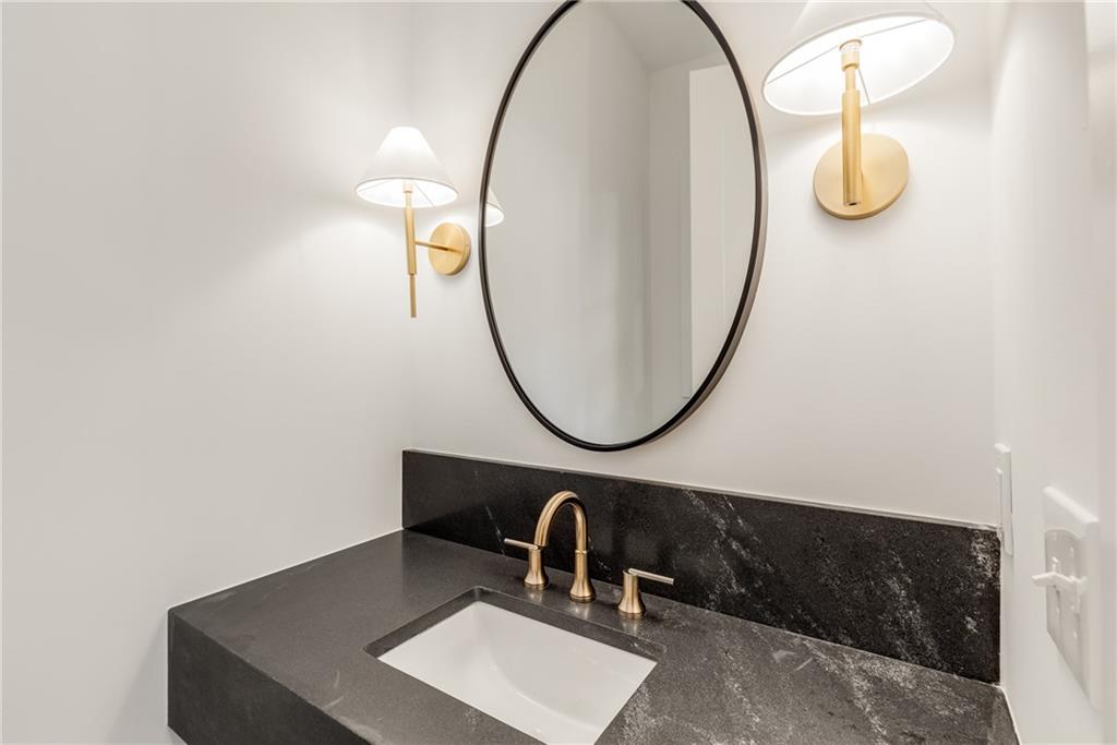 628 Robinson Avenue Southeast, Unit B Atlanta, GA 30312 - Photo 23 of 77 a bathroom with a sink and a mirror