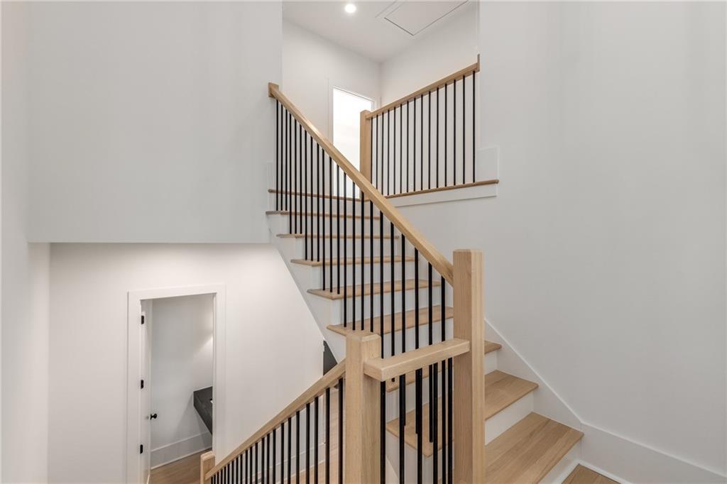 628 Robinson Avenue Southeast, Unit B Atlanta, GA 30312 - Photo 25 of 77 a view of staircase with railing and white walls