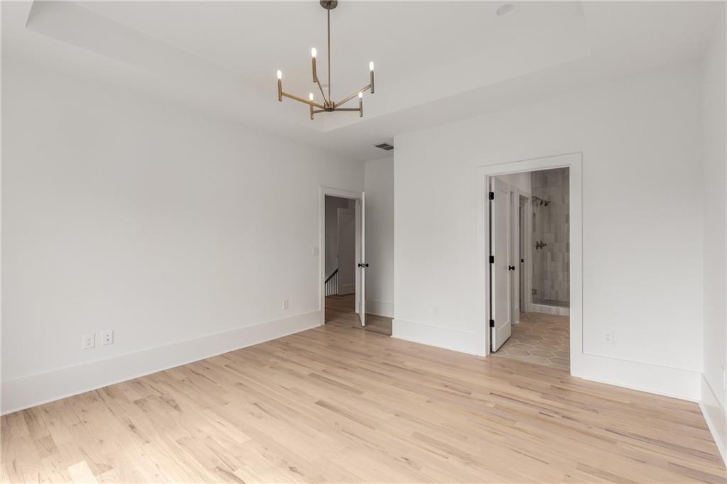628 Robinson Avenue Southeast, Unit B Atlanta, GA 30312 - Photo 32 of 77 a view of empty room with wooden floor and ceiling fan